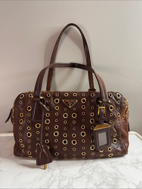 Prada Handbags - Prada Dark Brown Leather Grommet Satchel with Gold Hardware